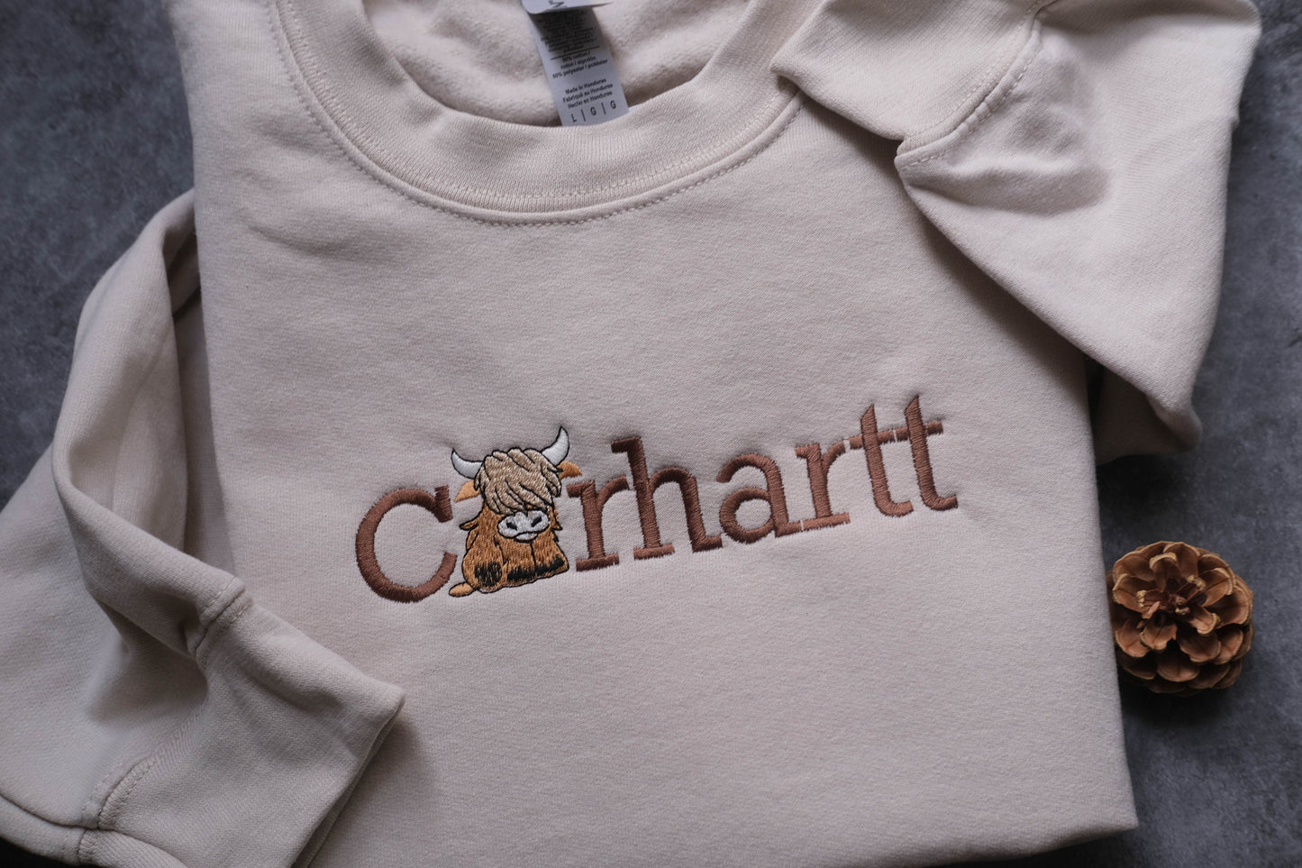 a white shirt with a picture of a cow on it