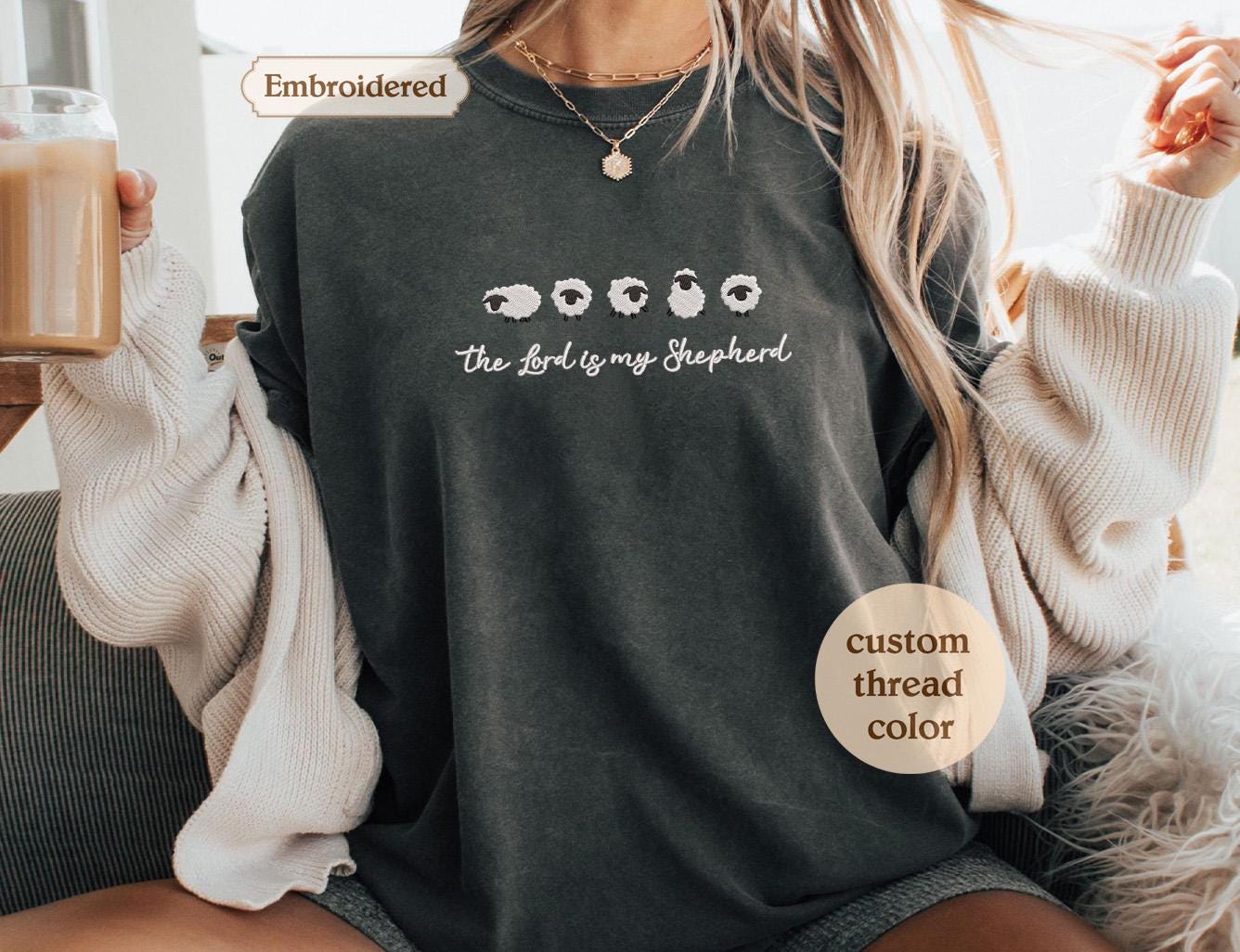 a woman sitting on a couch holding a cup of coffee