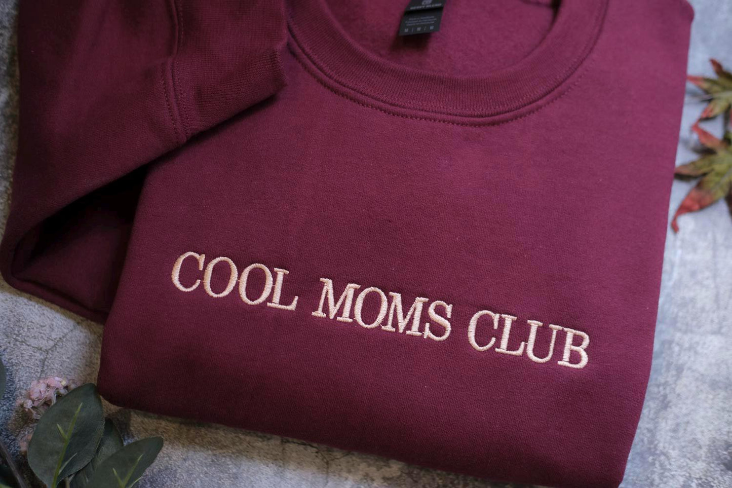 two shirts that say cool moms club on them