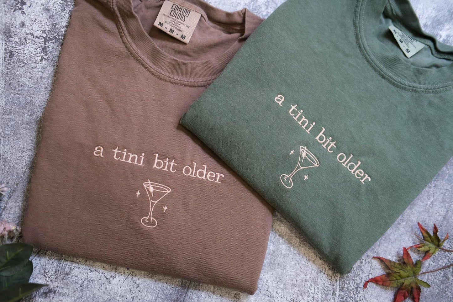 three t - shirts that say a thin bit older and a thin bit older