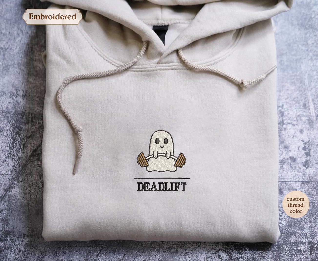 a white hooded sweatshirt with a ghost on it