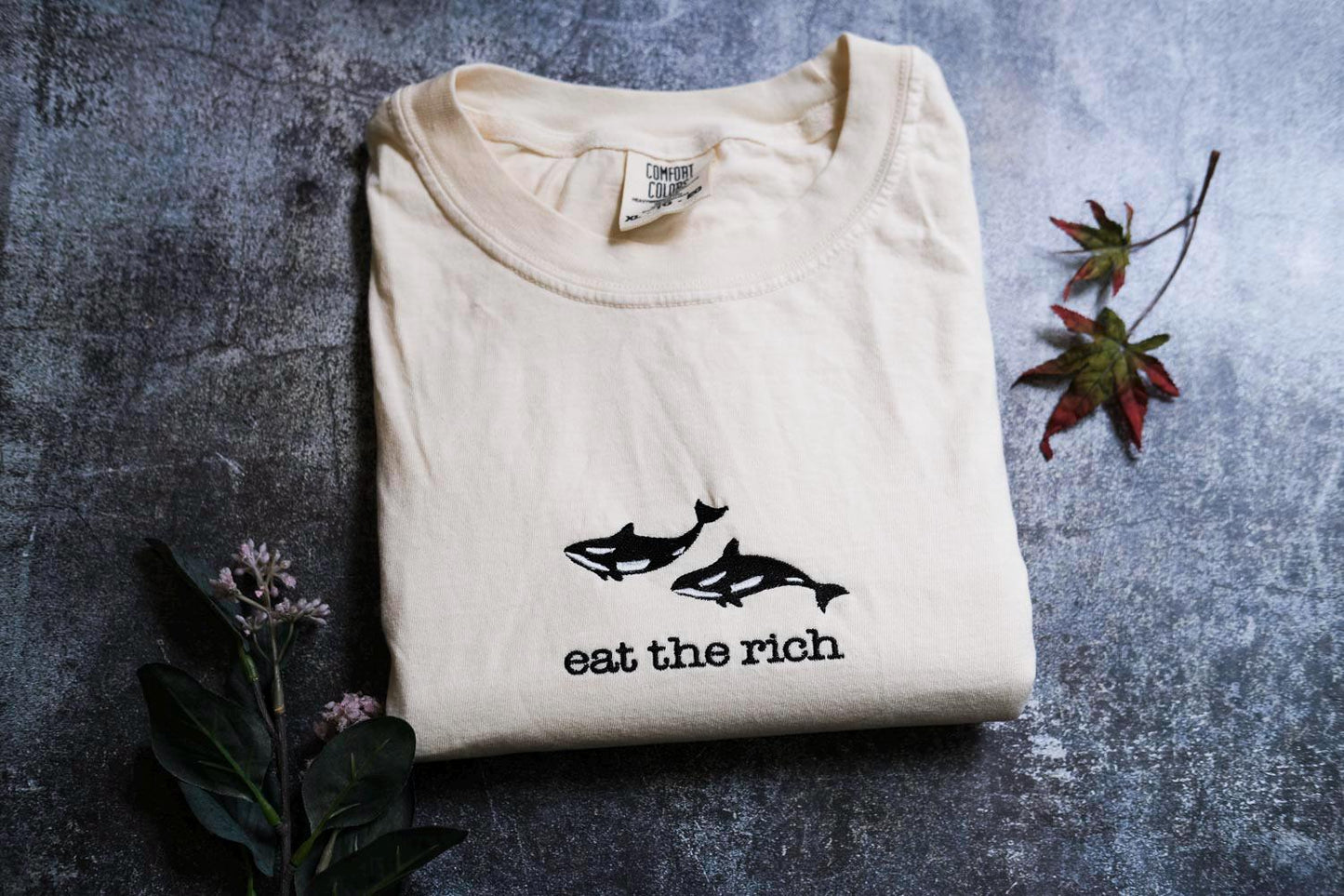 a t - shirt that says eat the rich on it