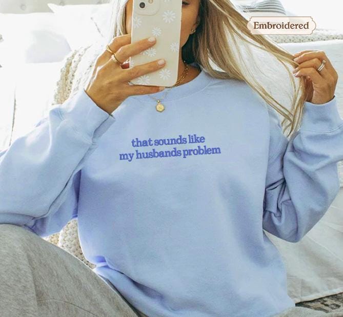 a woman taking a selfie with her cell phone