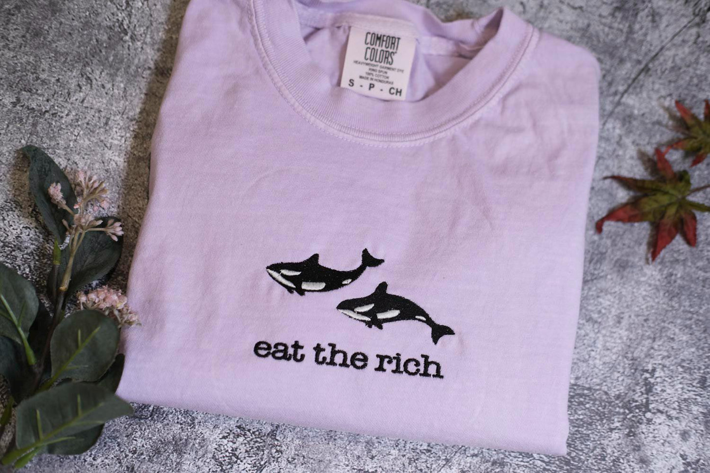 a t - shirt that says eat the rich on it