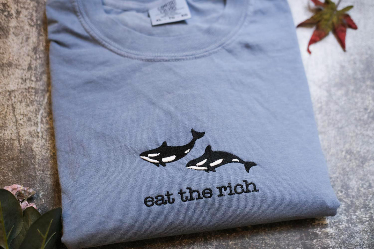 a t - shirt that says eat the rich on it