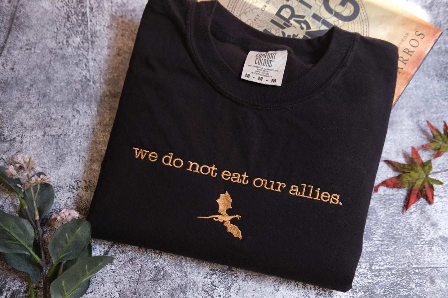 a t - shirt that says we do not eat our alles