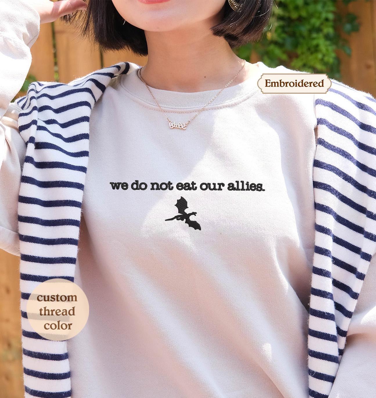 a woman wearing a t - shirt that says, we do not eat our all