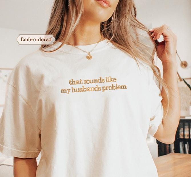 a woman wearing a t - shirt that says, that sounds like my husband '