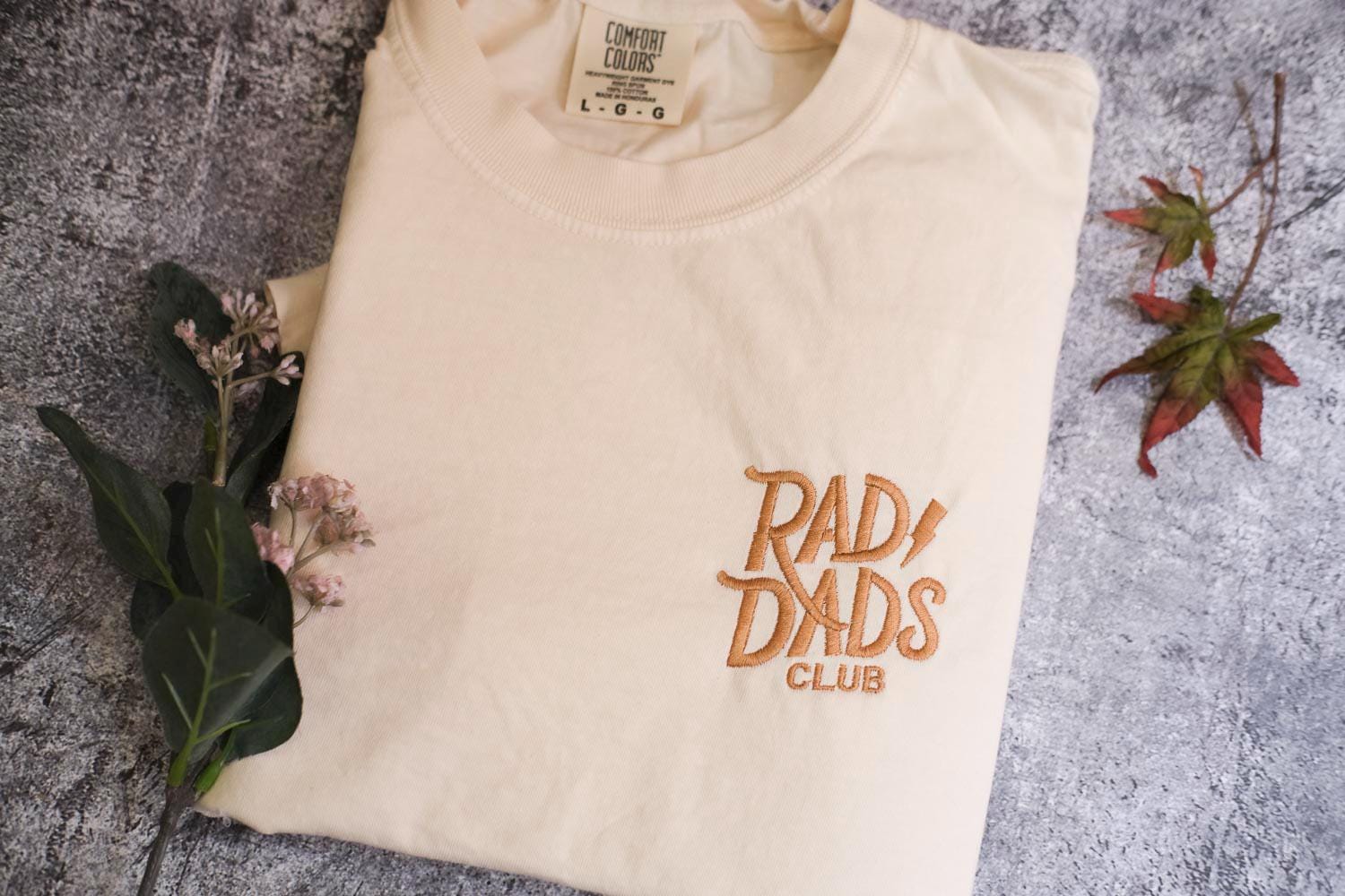 a t - shirt with the words rad dads club on it