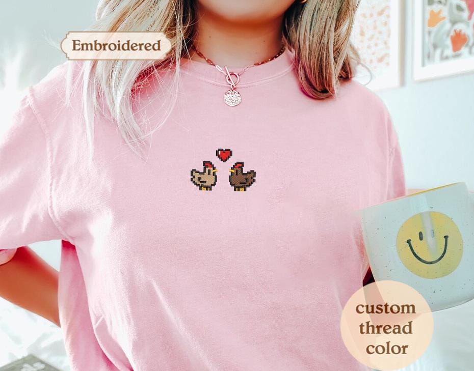 a woman wearing a pink shirt holding a coffee cup