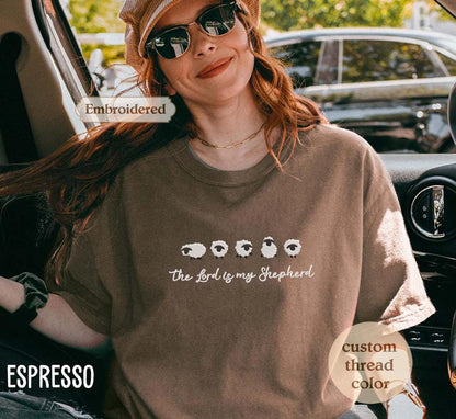 a woman sitting in a car wearing a hat and sunglasses