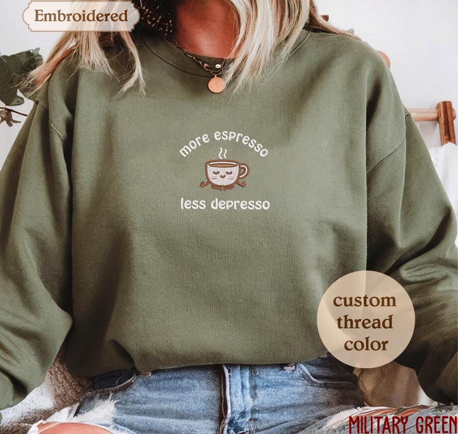 a woman wearing a sweatshirt that says more espresso less depresso