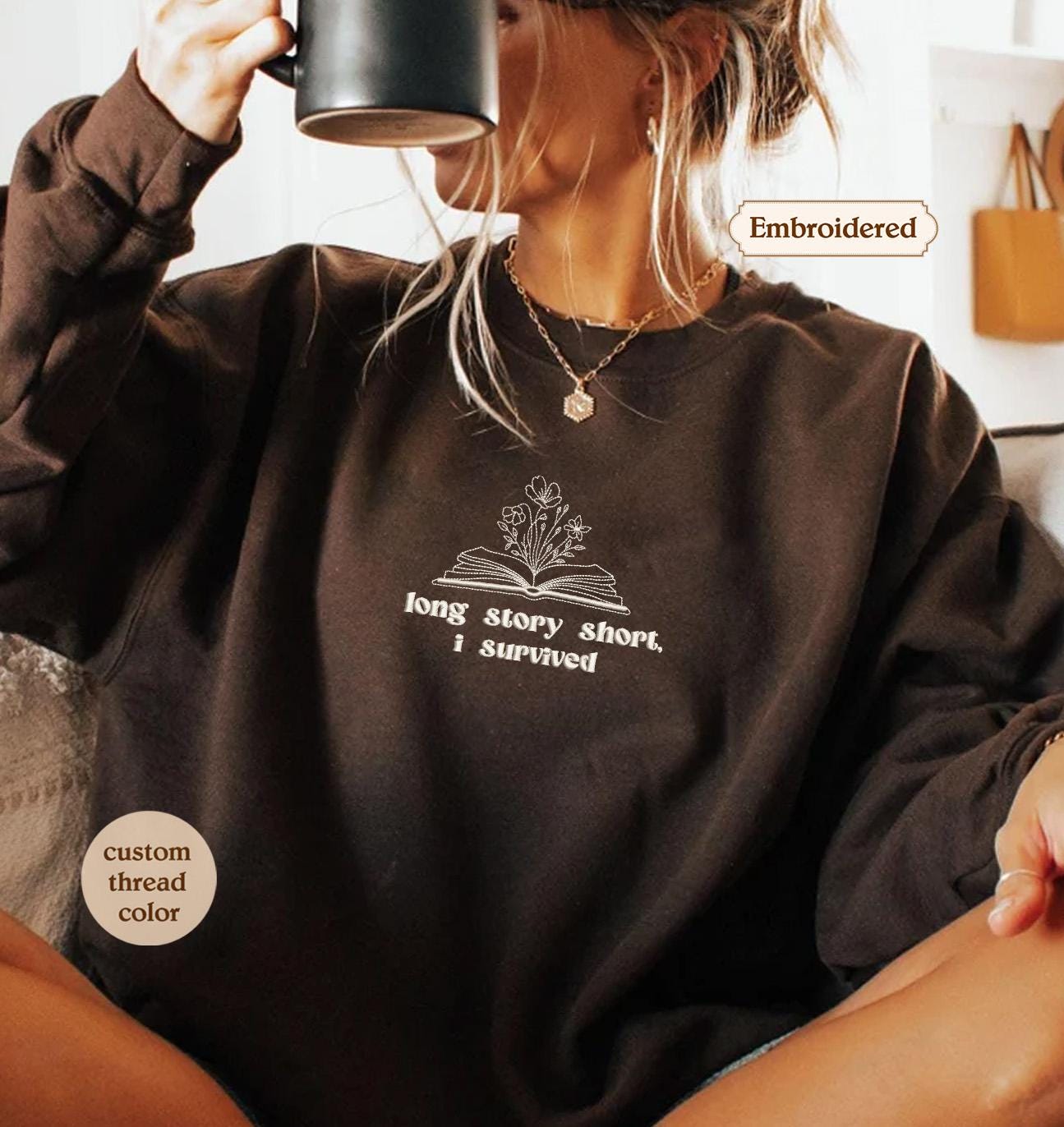 a woman sitting on a couch holding a cup of coffee