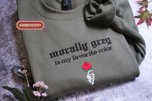 a t - shirt with a rose embroidered on it
