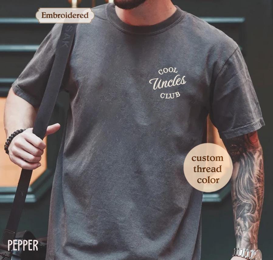 a man with a beard wearing a t - shirt that says cool uncle&#39;s
