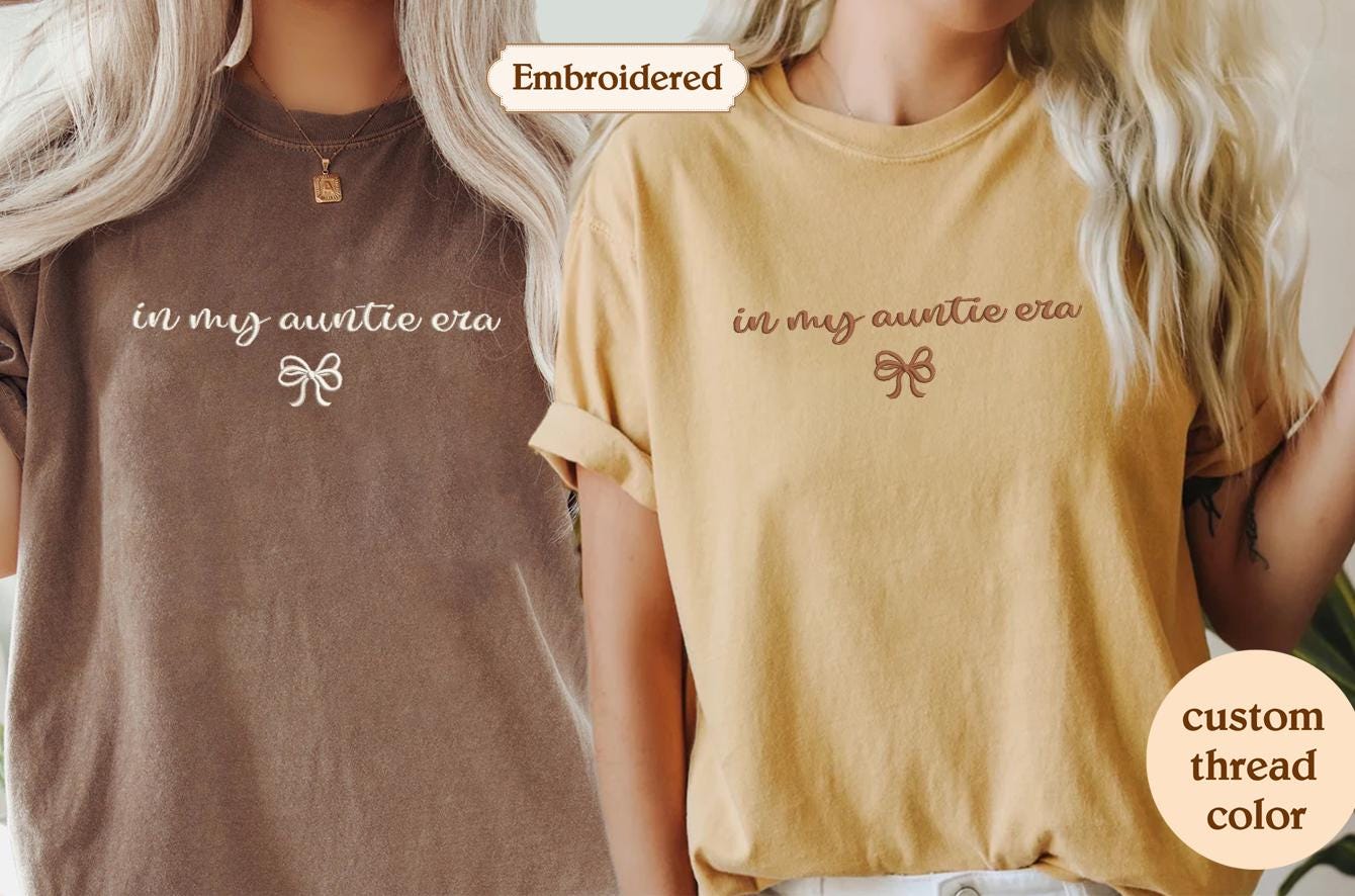two women wearing matching tshirts with the same color