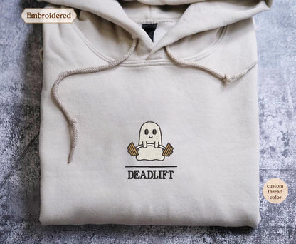 a white hooded sweatshirt with a ghost on it