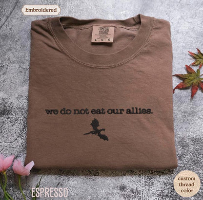 a t - shirt with the words we do not eat our allies on it
