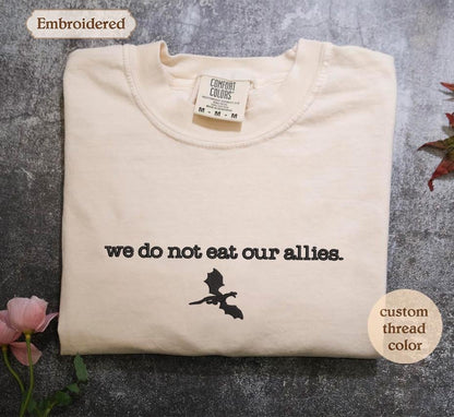 a t - shirt with the words we do not eat our allies on it