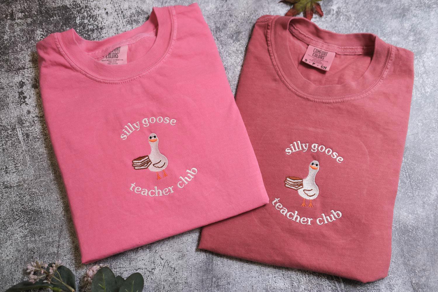 two t - shirts with a duck and a goose on them