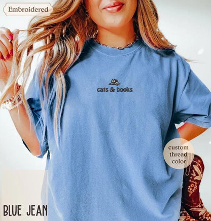 a woman in a blue shirt posing for a picture