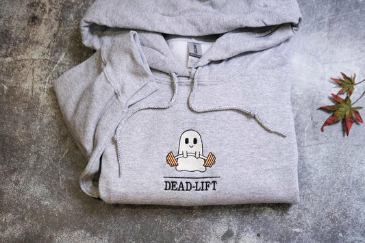 a grey hoodie with a ghost on it