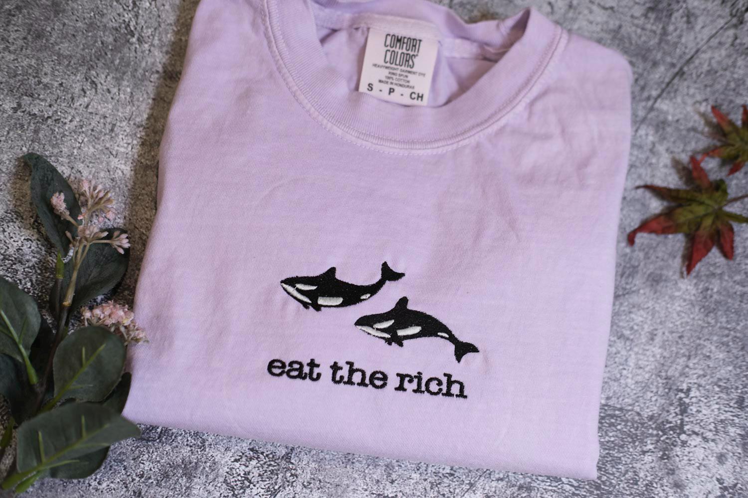 a t - shirt that says eat the rich on it