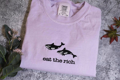 a t - shirt that says eat the rich on it