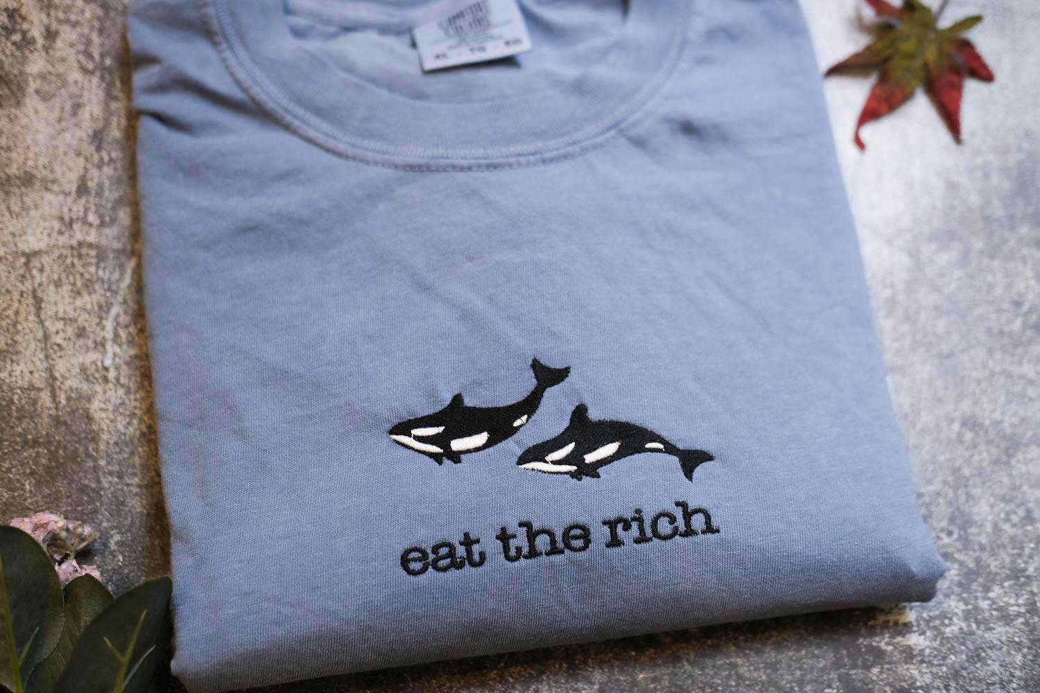 a t - shirt that says eat the rich on it
