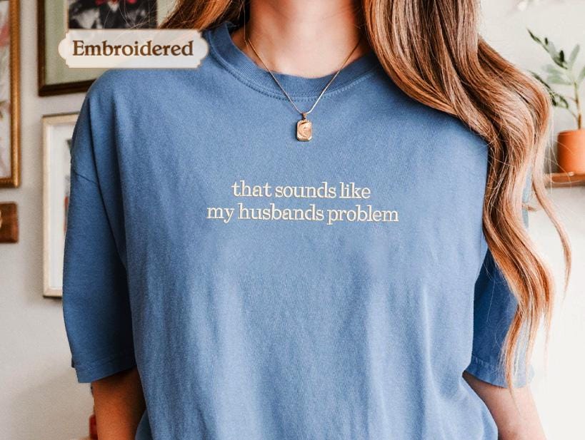 a woman wearing a t - shirt that says that sounds like my husband&#39;s